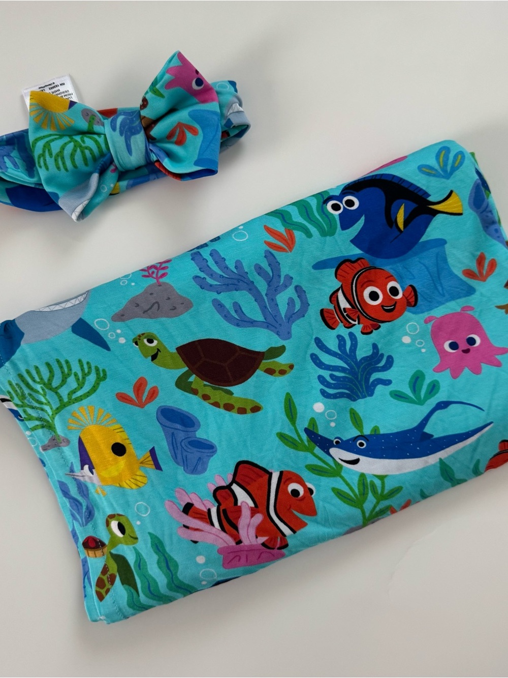Little Sleepies x Finding Nemo swaddle + headband
